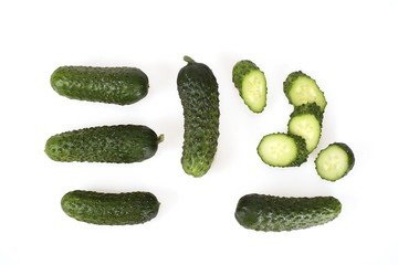 Fresh green cucumbers isolated on white background (top view)