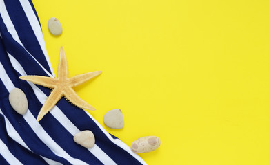 Yellow travel concept for sea or beach. Old vintage camera, Bikini top, seastar. Flat layout summer.