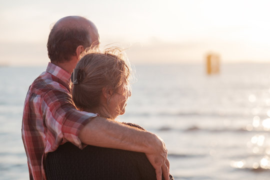 elderly couple rest near seashore. Concept of true love and long time together