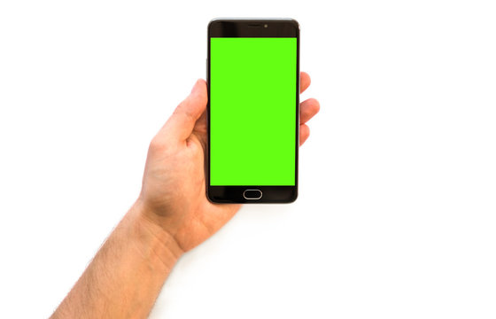 Online payments plastic card A man holding a smartphone with green screen for chroma key comp