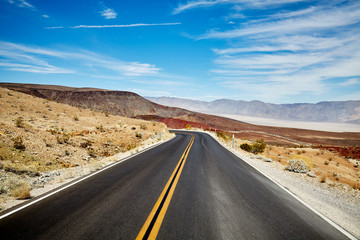 Fototapeta na wymiar Picture of a desert road, travel concept.