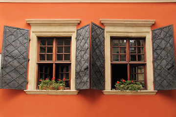 Window with Wooden Shutters, Decorated With Fresh Flowers. Lviv, Ukraine