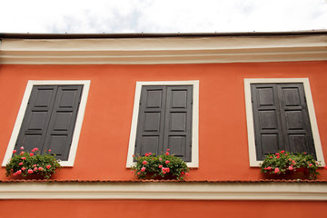 Window with Wooden Shutters, Decorated With Fresh Flowers