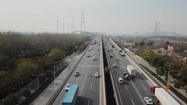 aerial shooting of traffic on big industrial chinnese city slow-motion
