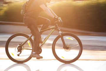 Fototapeta na wymiar man on a bicycle in a summer sunny city