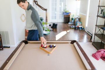Interior inside house home with billiard pool table in living room, young man in winter cold...