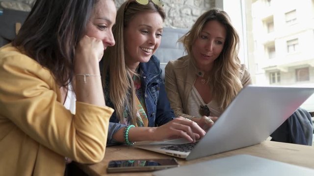 Friends connected on internet in coffeeshop