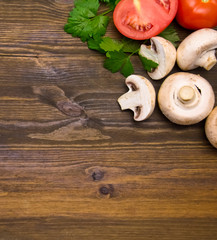 mushrooms mushrooms with parsley and tomatoes on wooden background
