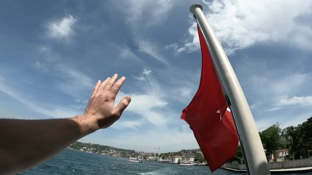 Turkish flag waving on the stern of an Istanbul Ship is Floating, Tukriye Bye bye