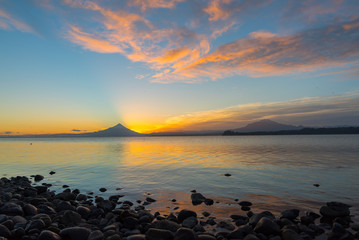 Landscape at sunrise on Lake Llanquihue with Osorno volcano and Calbuco in the background, southern...