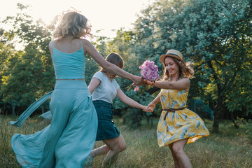 Group of girls friends making picnic outdoor. They dance roundelay with each other. bachelorette, party