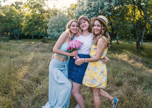 Three girls friends outdoor in the park or forest. bachelorette, party