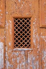 old grid on stained door