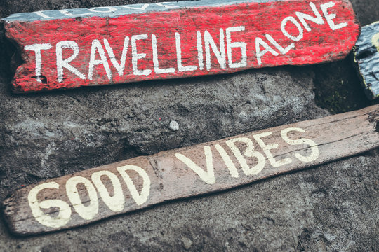 Good vibes text on a wooden board.