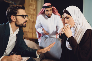 Arab woman with husband at psychologist reception