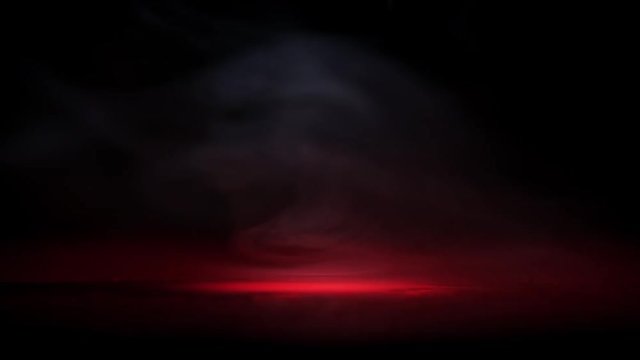 Crime scene blood droplets in light spot and cloud fog on black background. Red drops in fume smoke