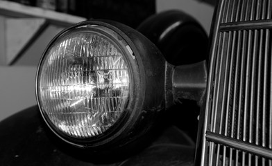 Headlights and radiator grill of an antique car
