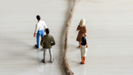Separate miniature men and miniature women.