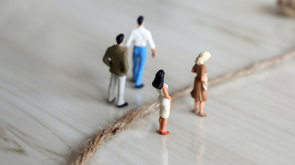 Discrimination between men and women. Miniature men and miniature women