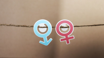 A mark of a man and woman hanging from a rope.
