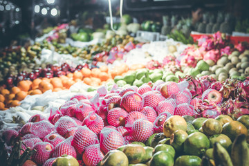 Variety of fresh fruits on organic food night market. Bali island, Indonesia.