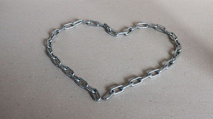 A heart shaped silver metal chain