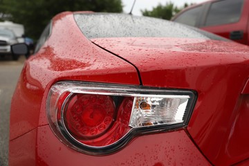 Red Sports Car Taillight in Rain