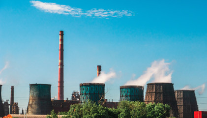 Obraz premium Industrial zone, Power plant with smoking chimneys or manufacturing factory, huge smokestacks with steam as environment pollution