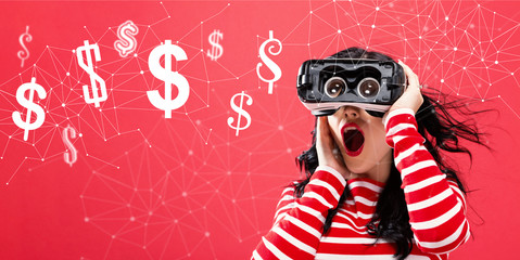 Dollars with young woman using a virtual reality headset