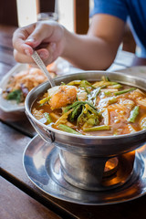 red curry Giant catfish eggs with vegetable in sour soup.