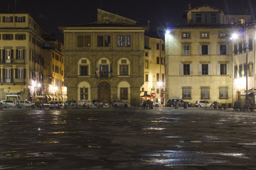Fototapeta na wymiar Night view of Santa Croce square in Florence, after rain