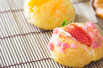 Delicious choux cream on plate