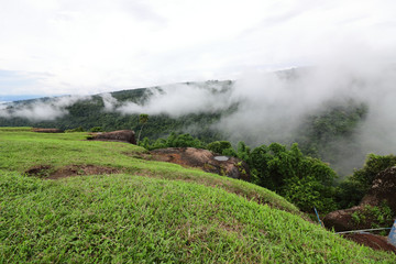 Tropical green mountain with heavy fog in rainy day