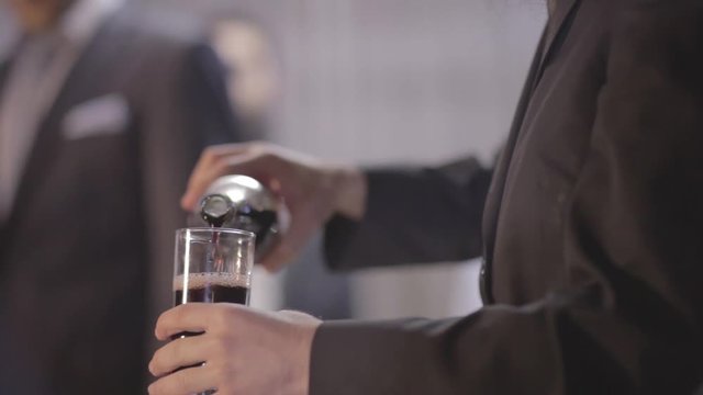 A rabbi pours wine at a hupa
