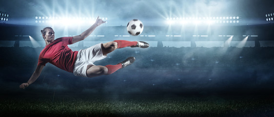 Soccer player in action on stadium background. - 207587602