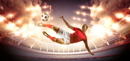 Naklejka premium Soccer player in action on stadium background.