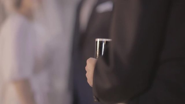 A rabbi pours wine at a hupa