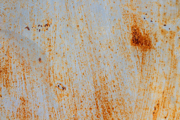 A background of peeling paint and rusty old metal