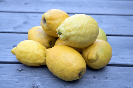 pile of yellow lemons of wood