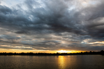 colorful dramatic sky with cloud at sunset.