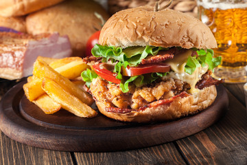 Chickenburger with bacon, tomato, cheese and lettuce