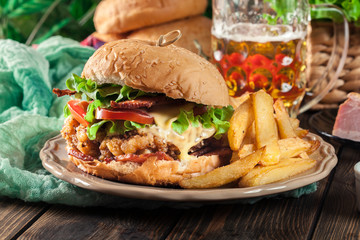 Chickenburger with bacon, tomato, cheese and lettuce