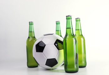 Bottles of fresh beer with soccer ball