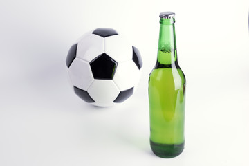 One bottle of fresh beer with soccer ball on white background