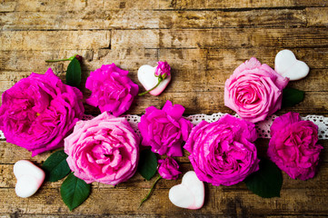 Pink roses arrangement on a wooden table