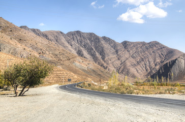 Empty road towards the Dasht-e Lut desert, Iran.