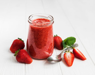 Jar with strawberry smoothie