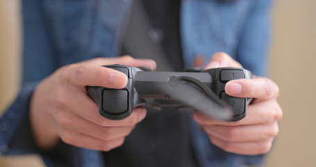 Close up of Woman playing game on console