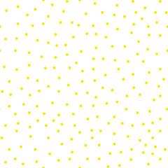 Ditsy vector polka dot pattern with scattered hand drawn small circles in yellow gold and white colors. Seamless texture in vintage 1960s fashion style. Modern hipster background with round shapes