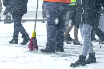 A man cleans the road from the snow.